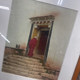 Monk Entering Home