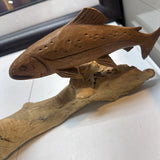 Carved Fish on Log